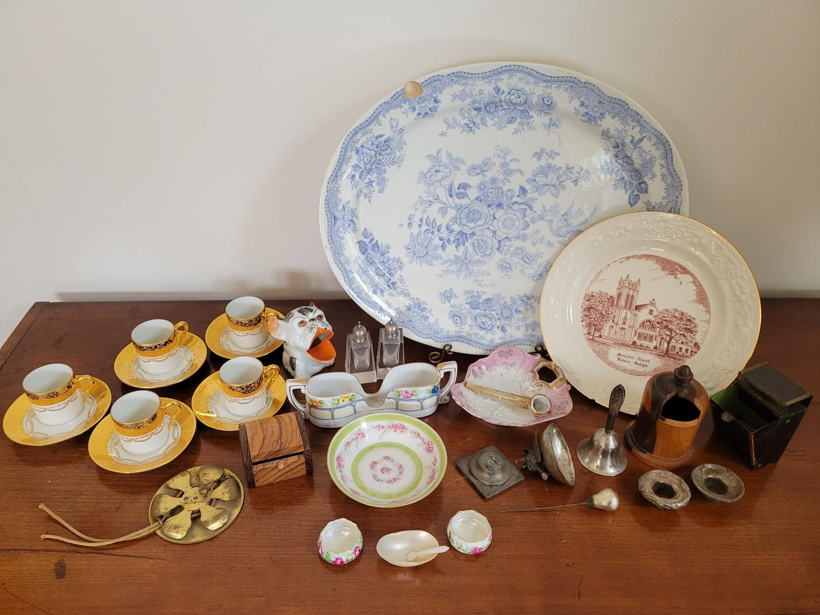 Estate Found Antiques & Collectables Grouping: This lot includes a wide assortment of antique, collectables, and housewares as found throughout the estate dining room. These objects range from antique porcelain, to a toleware match holder.&n