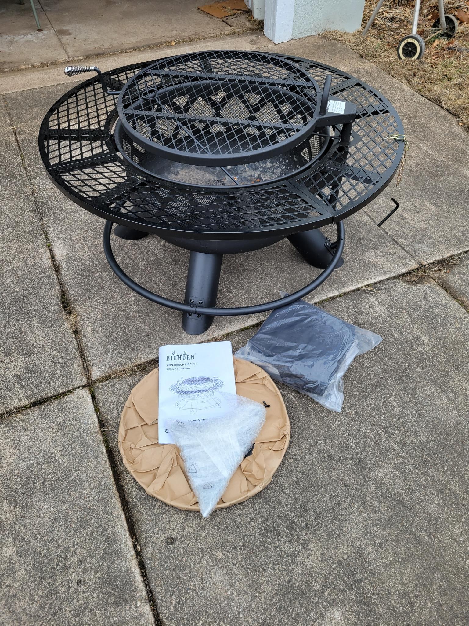 Bighorn 40in Ranch Fire Pit: This lot includes a Bighorn brand 40in Ranch style fire pit. The pit looks to have only been used a couple times before being stored away. Appears to include all parts and the original man