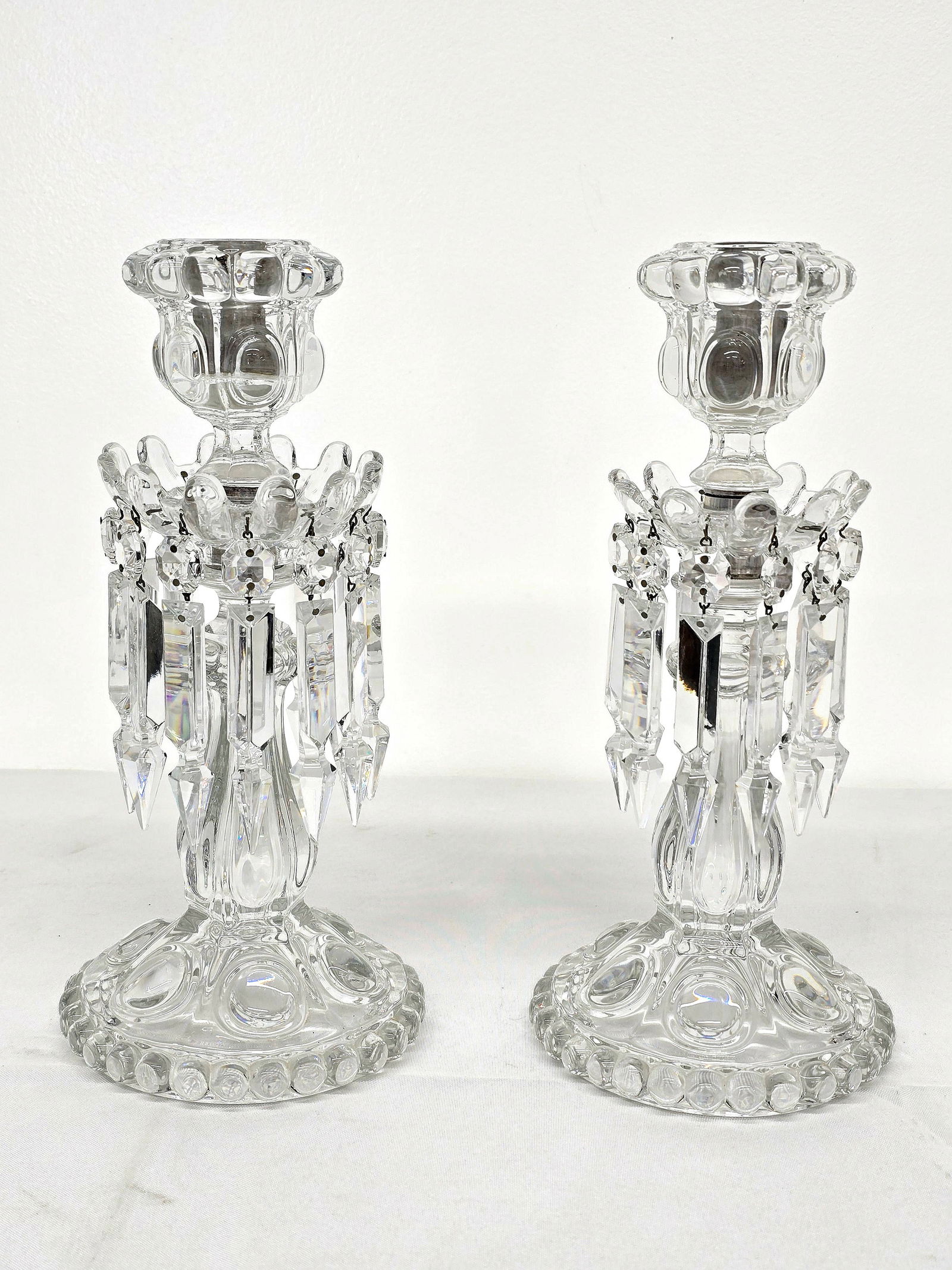 Pair of Baccarat Crystal Single-Light Lusters: The pair of lusters are in beautiful condition, with no chips or damage that we could see. The pieces are marked on the bottom with the Baccarat mark, see lot photos for more information on the set an