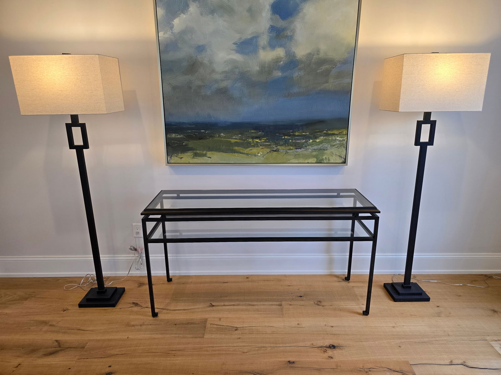 Pair of Ethan Allen Modena Iron Floor Lamps ?? Textured Black Finish: This lot is for a pair of Ethan Allen Modena floor lamps in textured black iron, featuring a tall open-square design and slim profile. Stands approximately 65.5" high and includes harp, square white s