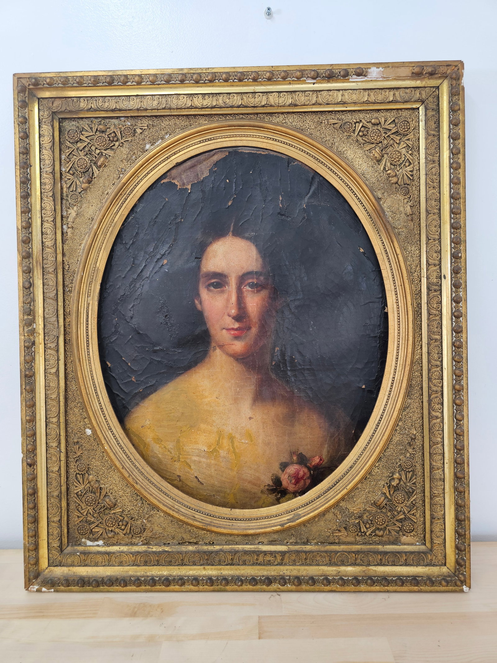 Victorian Portrait of Women Oil on Canvas in Period Gilt Wood Frame: The portrait is painted on an oval canvas and is in fair antique condition, showing some losses and light damage. It is not properly seated in the frame as it sits currently. The frame is period and a