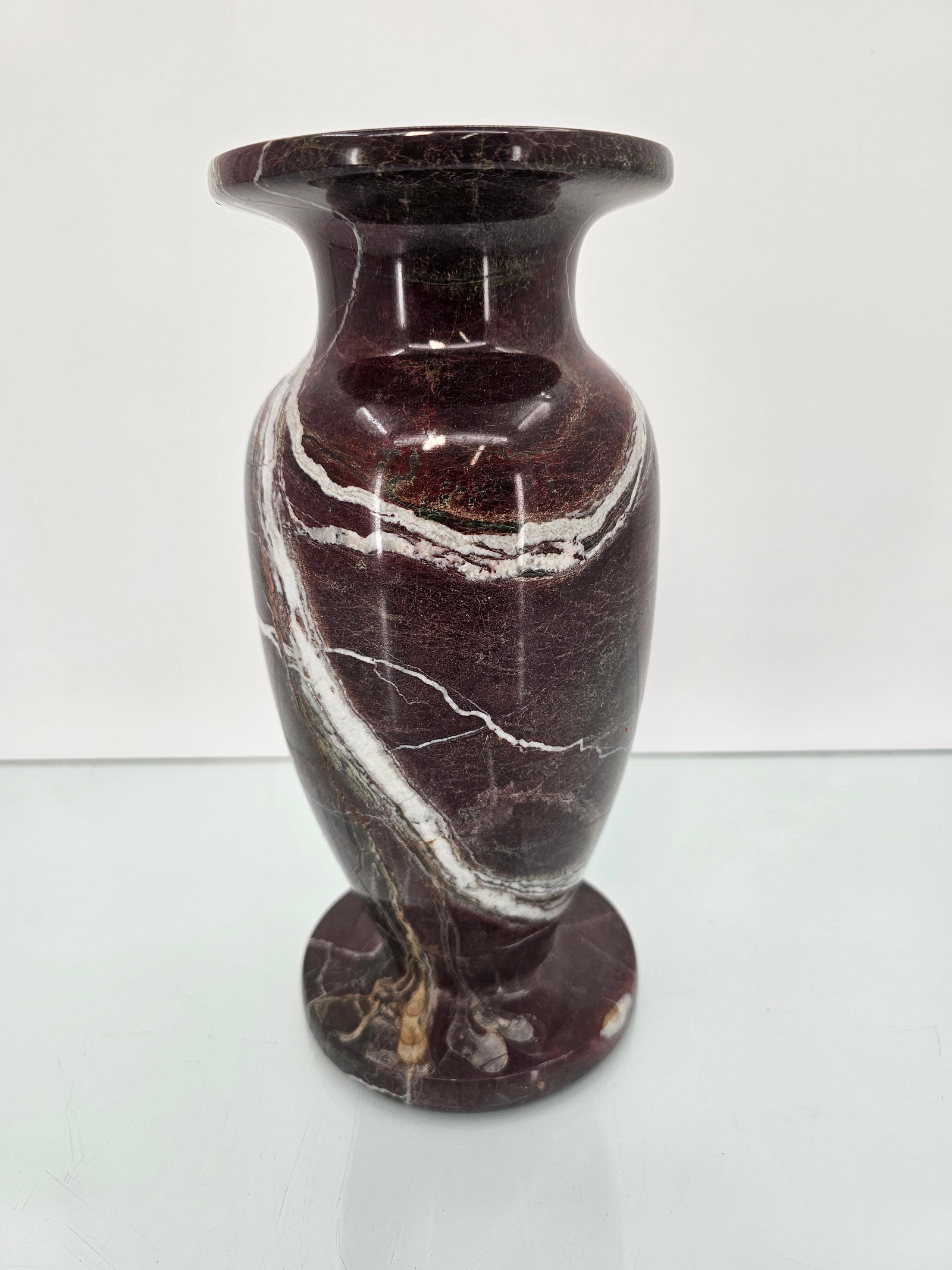 Vintage Oxblood Red Carved Marble Vase: The vase is of fine quality, featuring a deep red tone with white and brown colors mixed in. Carved from a single piece and appearing vintage in age. See lot photos for more details and lot informatio
