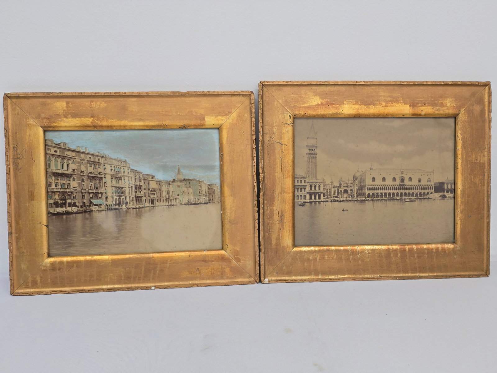 Pair of Antique Venice Prints w/ Reverse Glass Overpaint: This Lot includes a pair of wonderfully detailed prints of buildings in Venice, showing some reverse on glass overpaint. They are in period style gilt wood frames and in overall very good antique cond