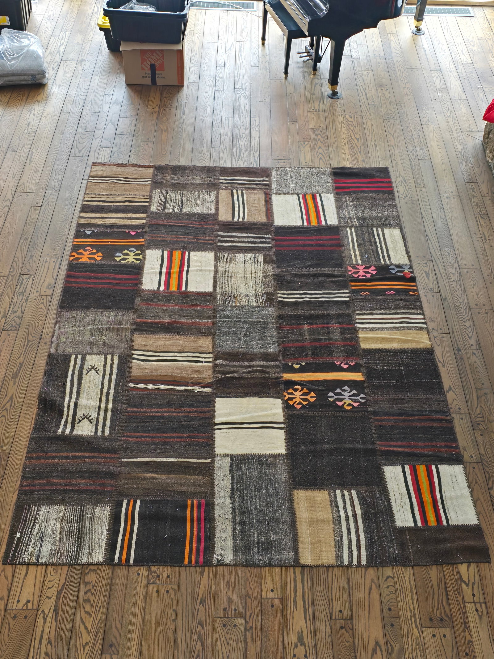 Vintage Patchwork Style Kilim Wood Rug: The rug is made of Kilim wood and in good overall condition, in a patchwork almost quilted style. Appearing 20th century in age, see lot photos for more detailsMeasures 137"L x 96"W