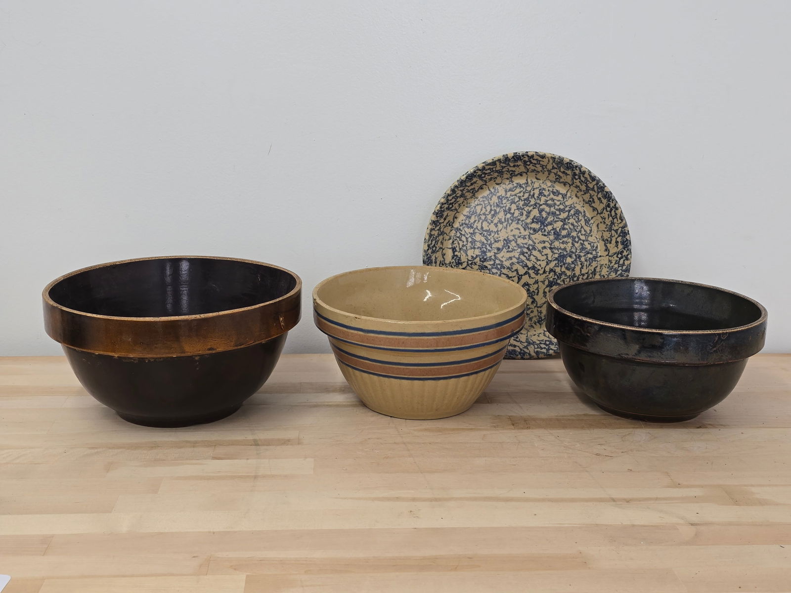 Lot of 3 Vintage Stoneware / Yellow Ware Mixing Bowls: The bowls are in good vintage condition, showing minor expected ware from age and use but no breaks or repairs. See lot photos for more information on the bowls and there conditions.Measurements shown