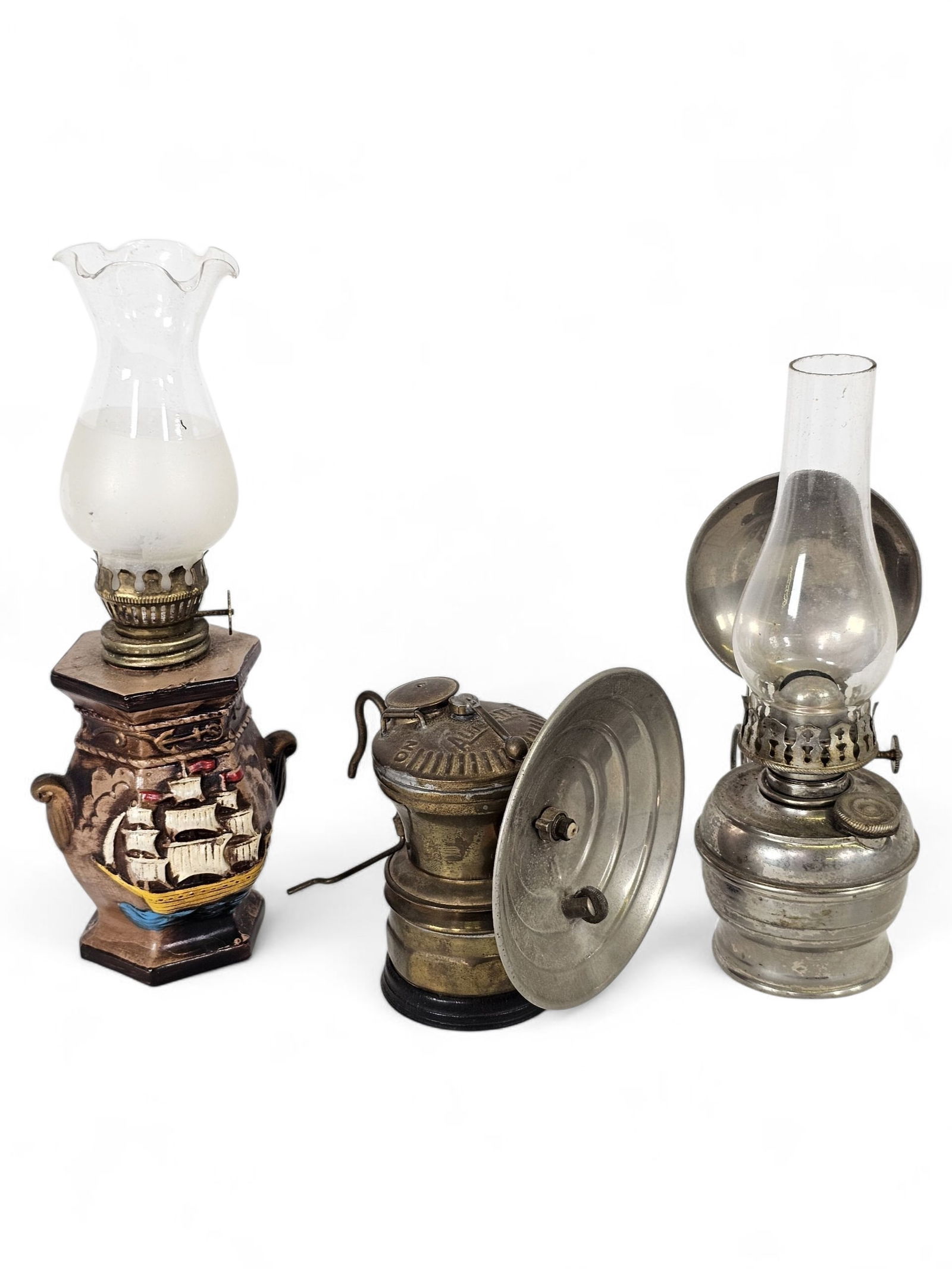 Lot of Miniature Lanterns & Miners Lanterns: This lot includes a small grouping of miniature lanterns, and a miners lamp. Everything is in good overall antique condition, showing expected signs of age and use. See lot photos for more information