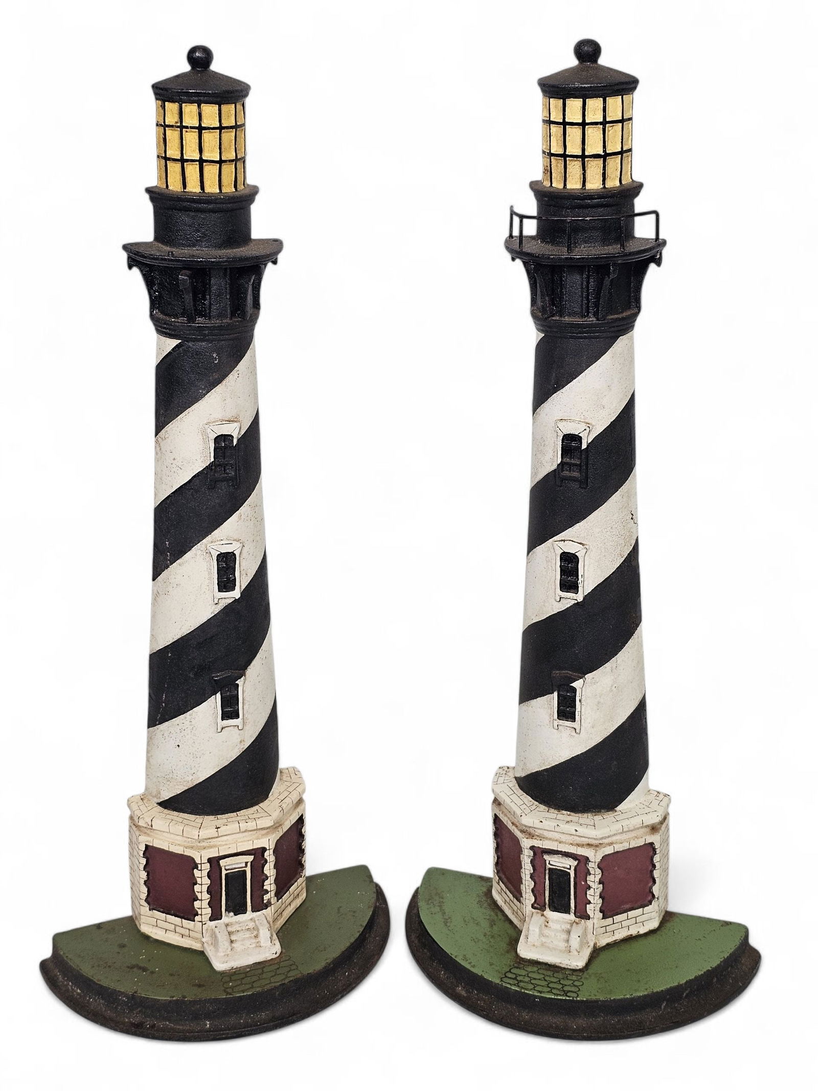 Pair of Large 21"T Cast Iron Lighthouse Doorstops: Both pieces are in good used condition, showing minor ware from age and use. They are large standing at 21"T and 8.25"W at the base, these appear to be modern in age but of quality. See lot photos for
