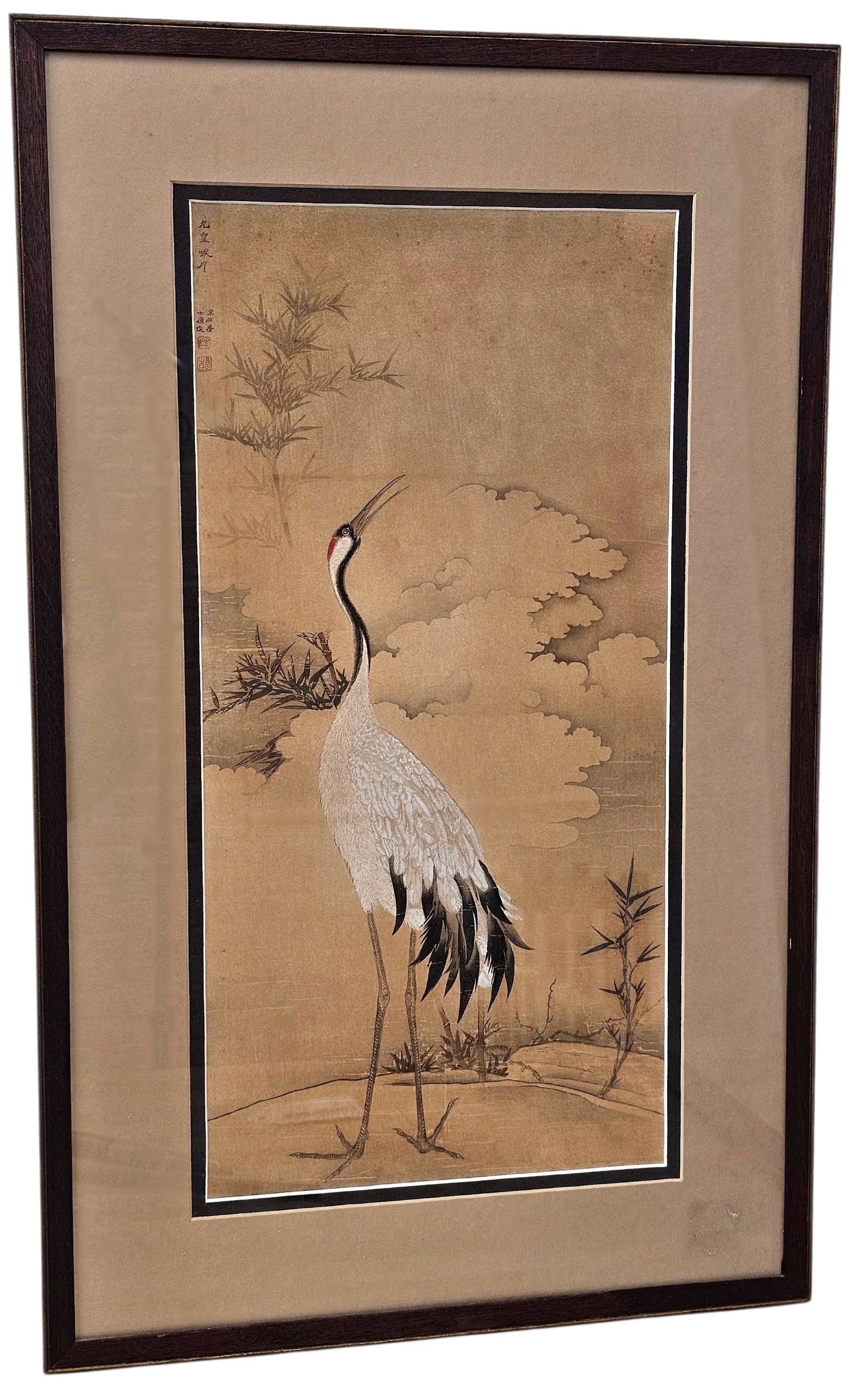 Oriental Ink Painting w/ Crane: This Chinese ink painting with color details is signed/stamped in upper left and framed and matted behind glass. Wear consistent with age including toning, discoloration, staining, and minor losses to