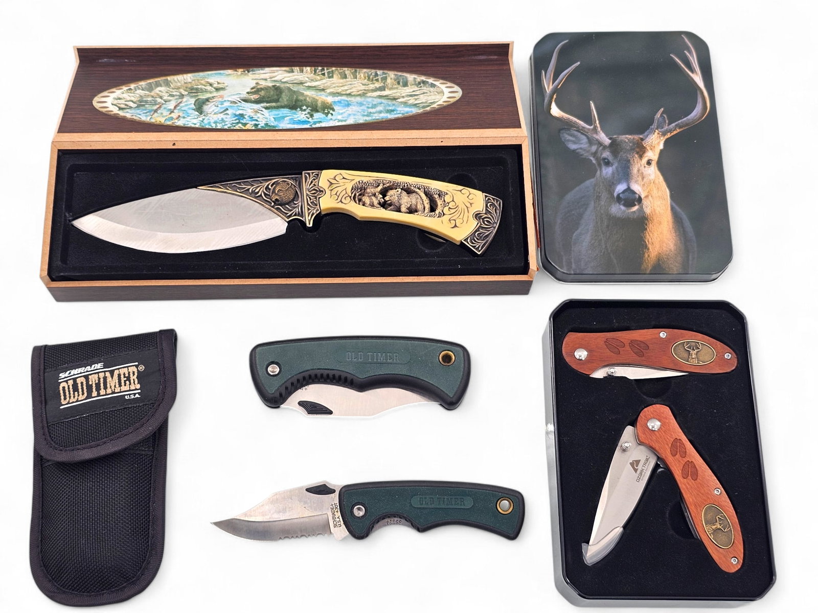 Grouping of 5 Folding & Hunting Knives - Schrade, Ozark Trail, & More: This lot includes 5 folding and hunting knives. Items include: two Schrade old timer knives (430T and 170T), a pair of folding Ozark trail knives with buck decorations in a metal Tin, and a decorative