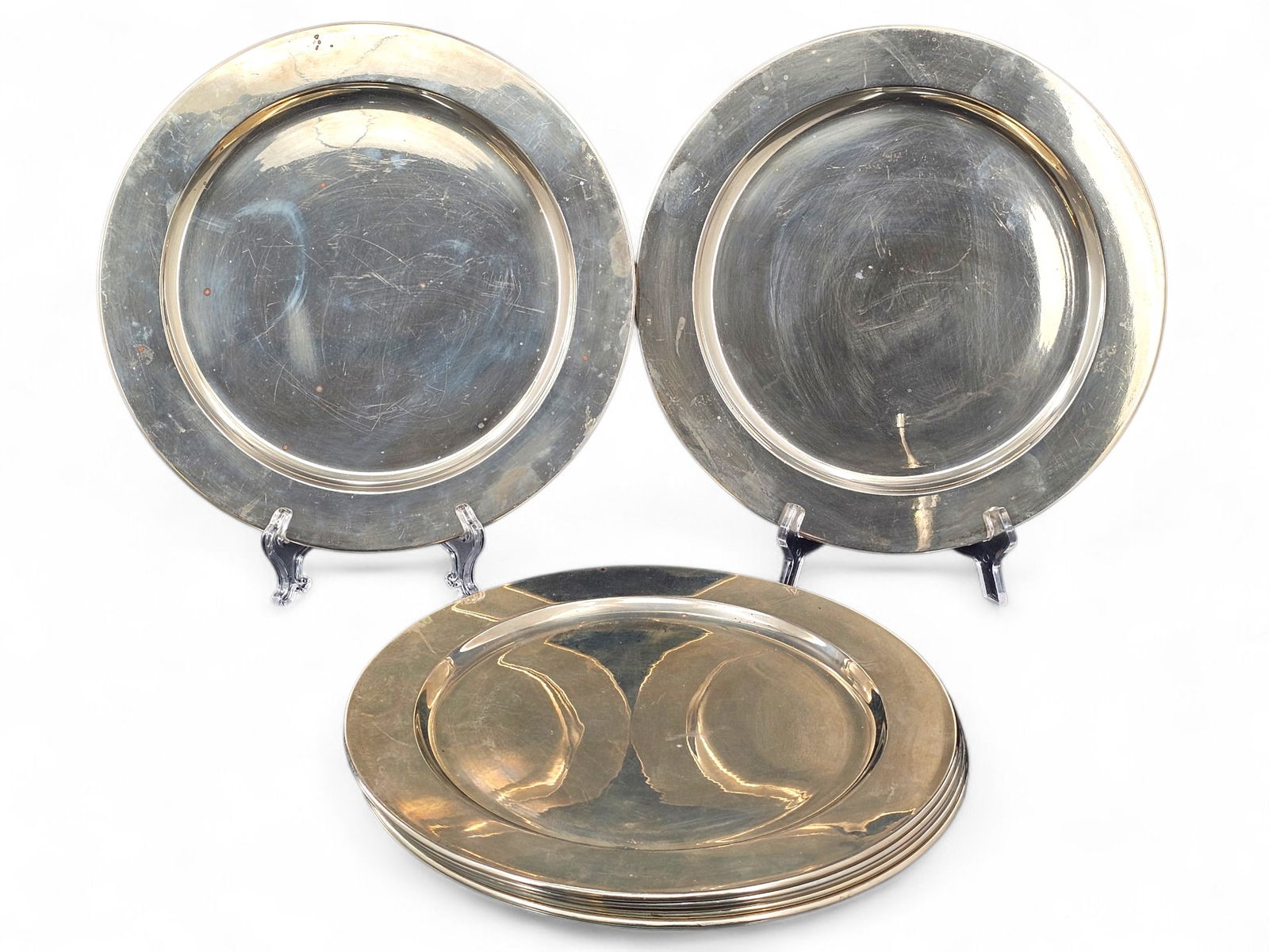(8pc) Mexican Alpaca/Nickel Silver Charger Plates -12" D: This lot includes 8 alpaca silver, also known as nickel silver, charger plates. They are marked "Alpaka hecho en Mexico U.G.G.". In overall good condition with expected wear from age and use including