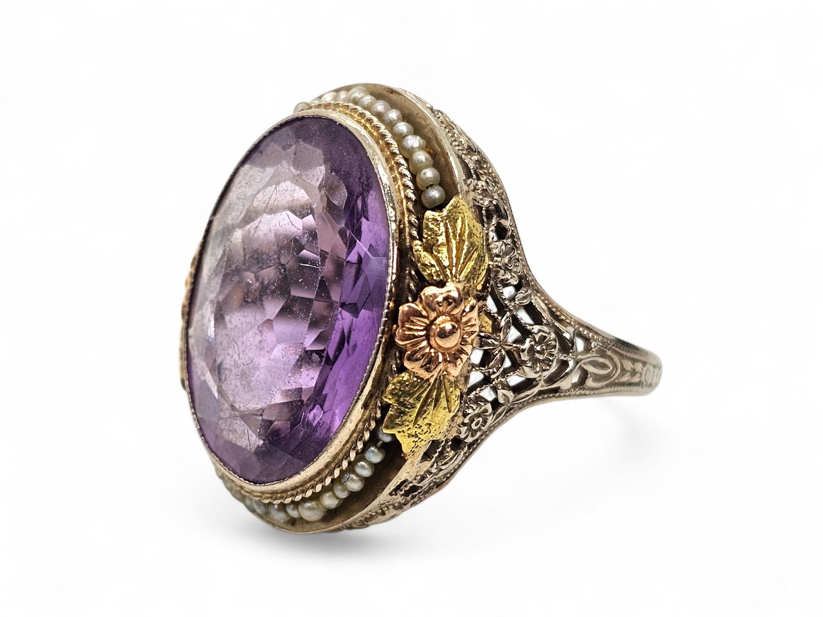 Antique 18K Two-Tone White & Yellow Gold Floral Ring w/ Cut Spinel Stone: Details: The ring appears vintage/antique in age, with a unique filigree rose design leading up to a large cut Spinel stone surrounded by small pearl beads. Material: 18K White Gold w/ Ye