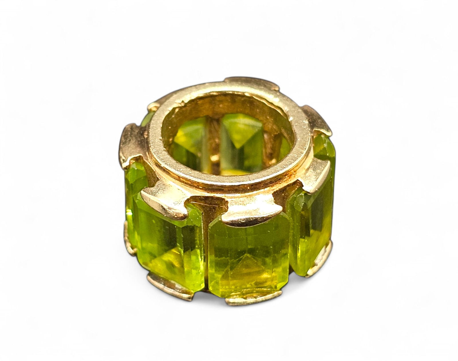 14K Yellow Gold Surrounded by Cut Green Peridot Stones - Round Necklace Pendant: Details: The pendant has a grouping of fine cut Peridot stones set into gold. Any chain can be thread through the center to give a unique charm bracelet style necklace pendant. Material: