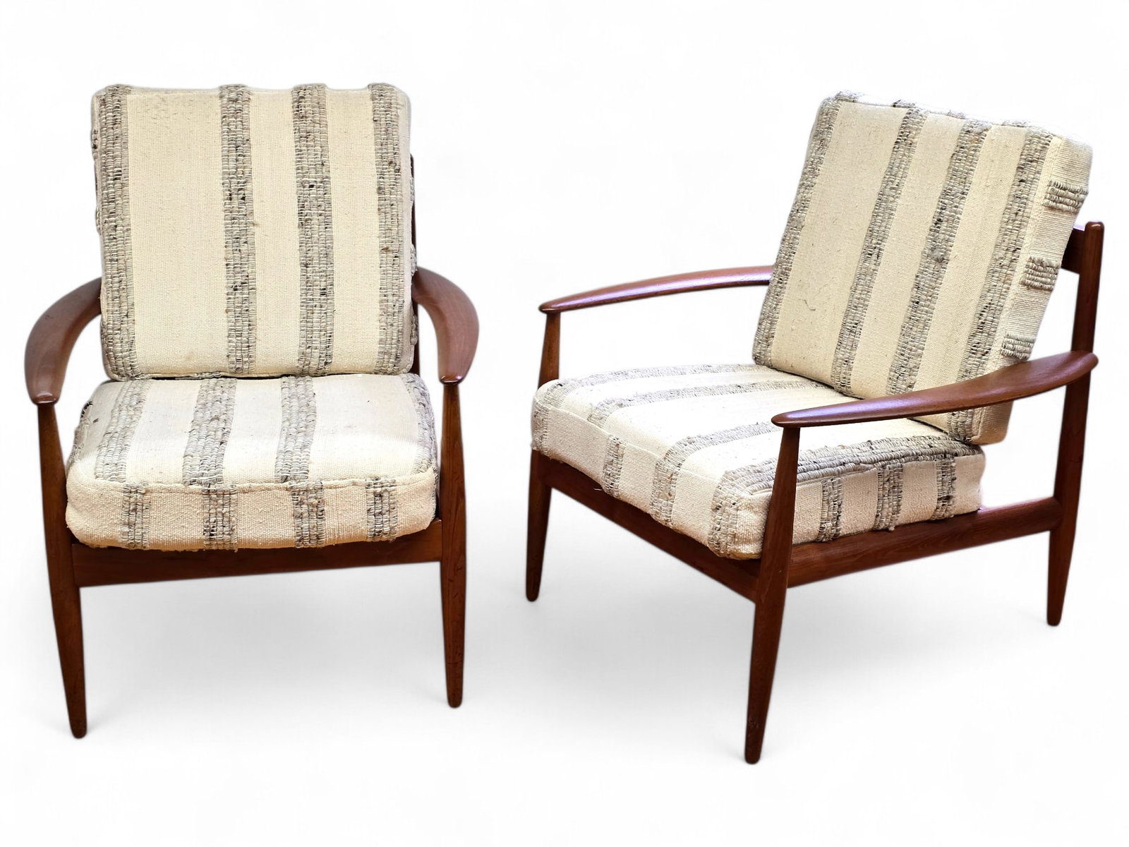 Pair of Gret Jalk Danish Teak Lounge Chairs:  A pair of midcentury modern Danish teak lounge chairs by Grete Jalk for France & Son. The chairs each have a seat and back cushion. Both chairs have France & Son Stickers. Produced by France &