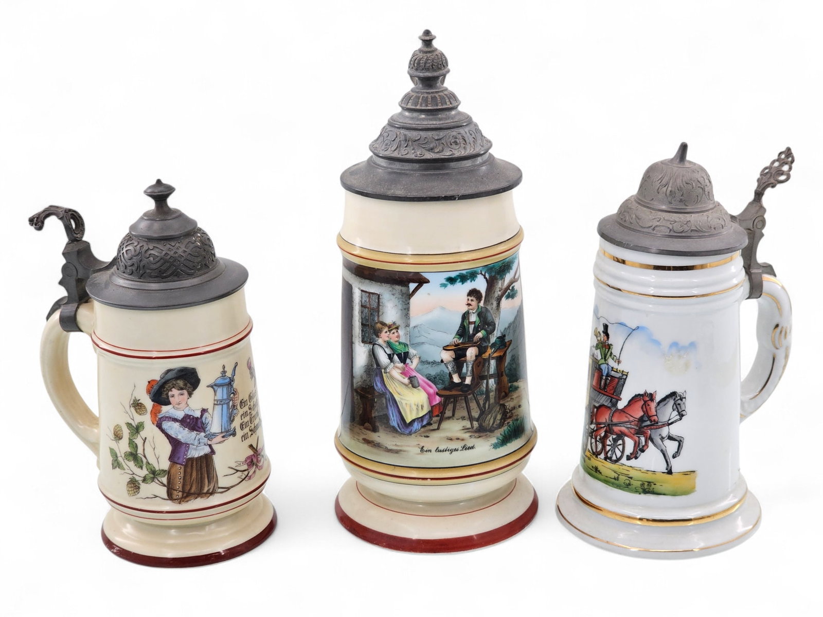 Grouping of 3 Hand Painted German Beer Steins: Group of three hand painted porcelain/ceramic beer steins with various scenes. Pewter lids. All three appear to be unmarked. Largest is marked 1L. Wear consistent with age and use including surface we