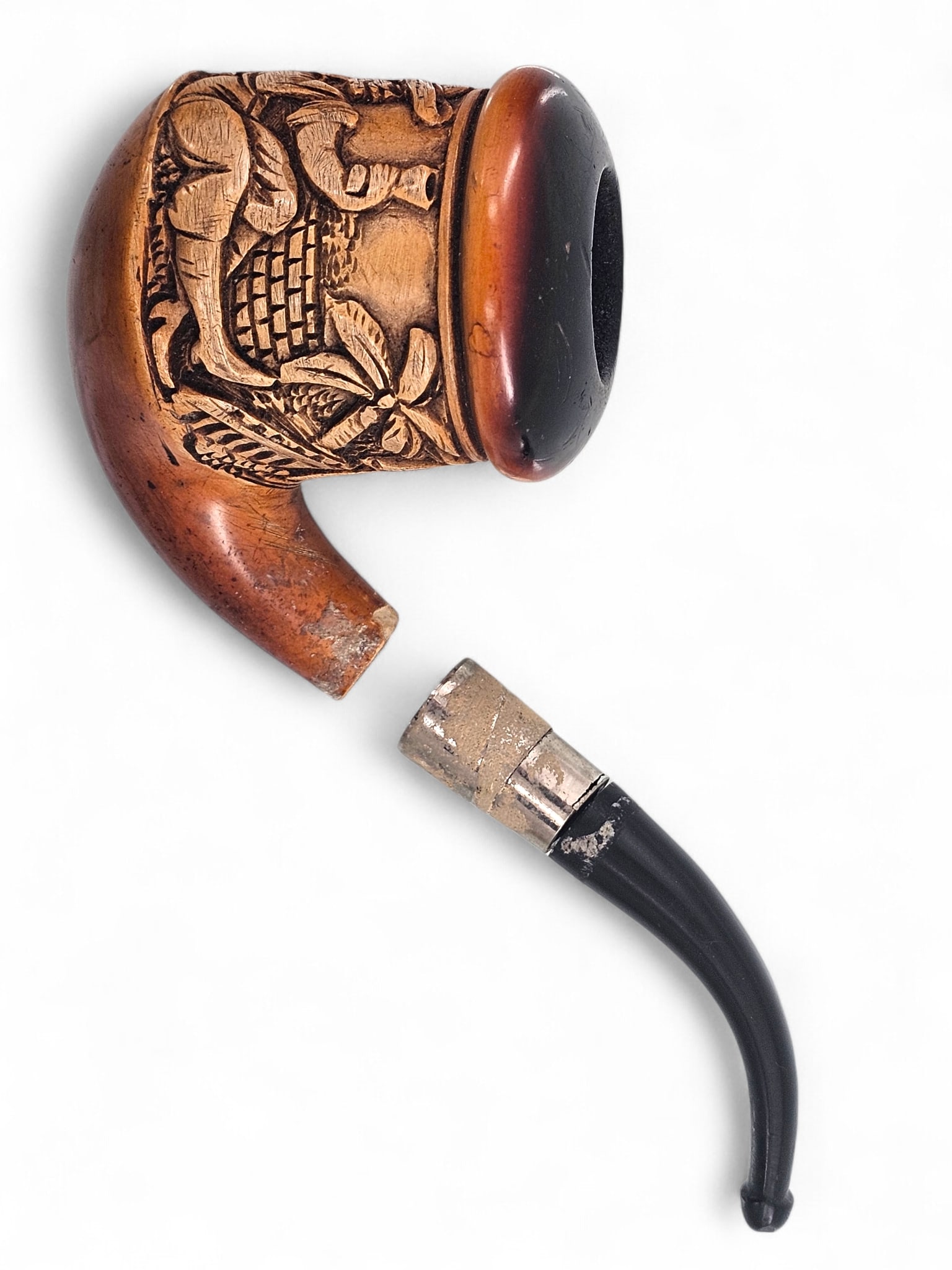 Meerschaum Pipe w/ Drinking Figure: Carved meerschaum tobacco smoking pipe with a reclining figure holding a drink. Mouthpiece is detached from pipe head. Wear consistent with age and use including discoloration and surface wear. See ph