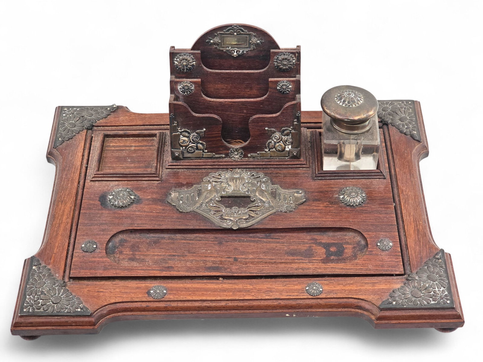 Antique Inkwell Desk Set: Antique desk writing set with glass inkwell. The set is made of wood and has metal accents. One inkwell is missing, Wear consistent with age and use including surface wear and oxidation. See photos fo