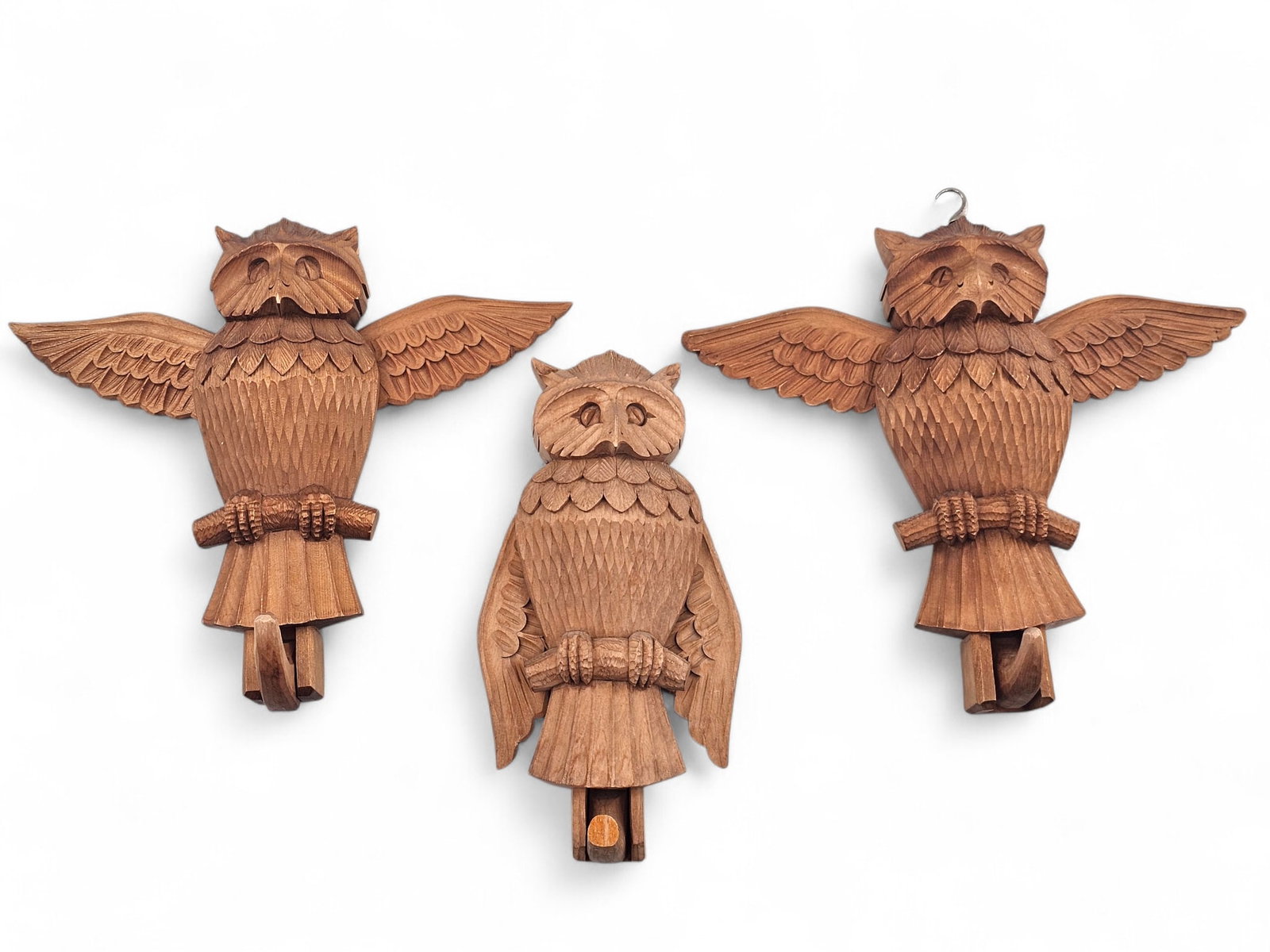 Grouping of 3 Russian Folk Art Owl Carved Wood Hanging Hooks: Grouping of 3 Vintage 1956 Soviet era Russian Folk art wooden carved owls with movable wings. The owl can be hung up on the wall and when the wood carved hook is pulled downward, both wings extend fro