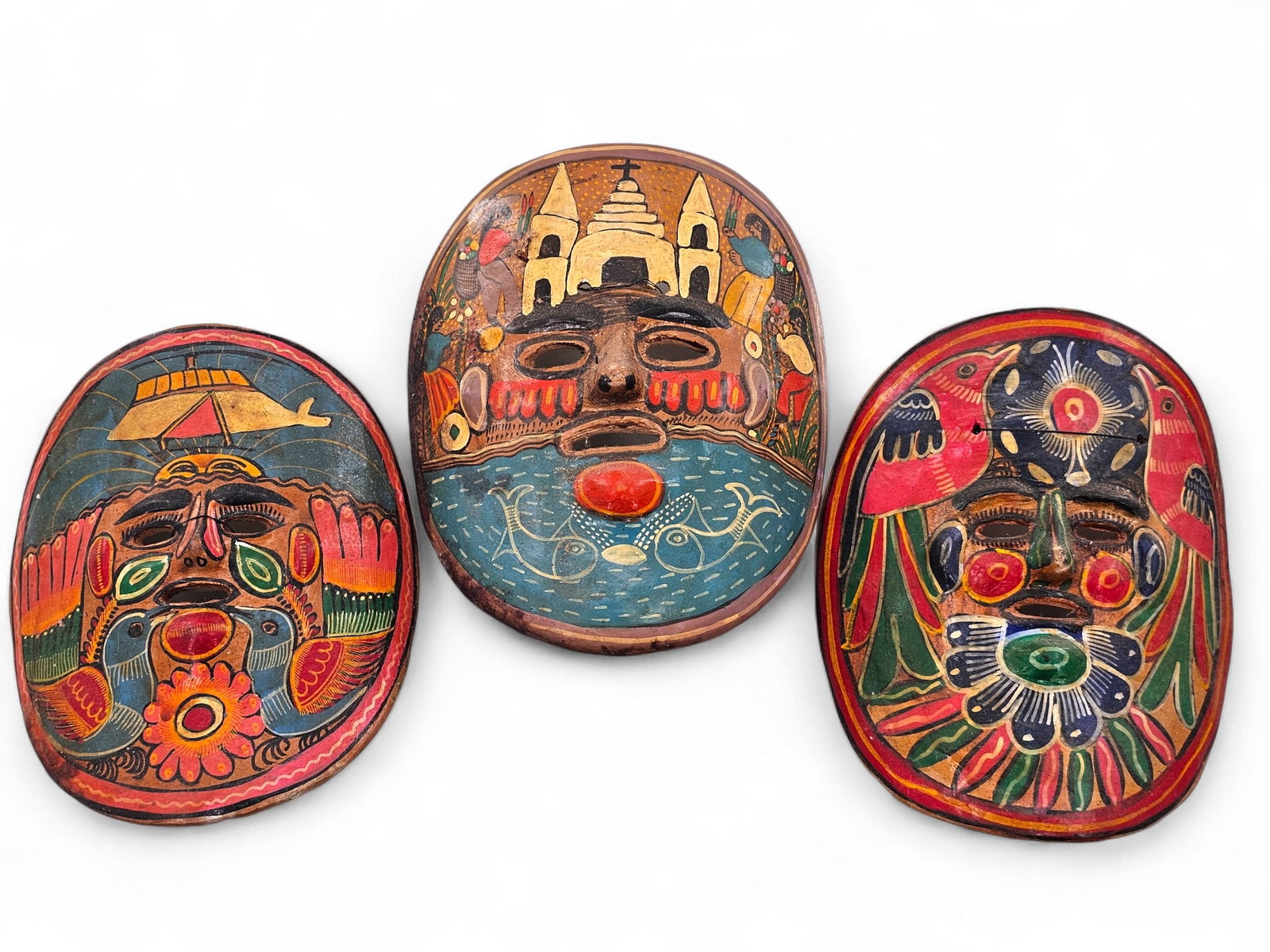 (3pc) Mexican Folk Art Terracotta Ceramic Masks: Grouping of 3 Mexican hand painted folk art masks. Ceramic teracotta with strings attached to back for hanging/display. Wear consistent with age including crazing, surface wear, and minor losses. See