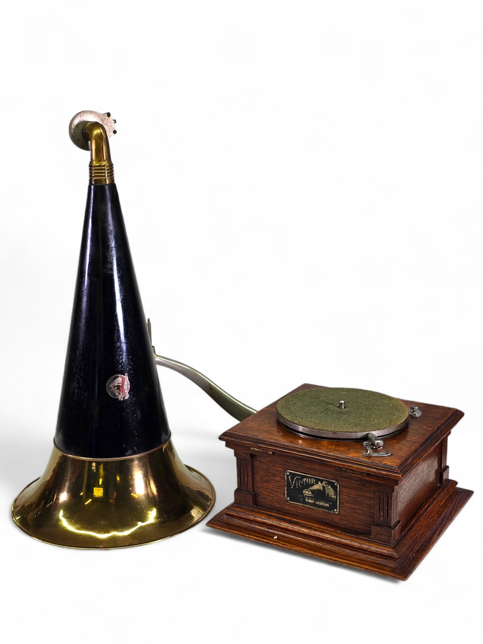 Victor Type E Front Mount Phonograph: Antique Victor phonograph offered as found from a private collector’s estate. The machine is housed in a polished oak case and includes its original marked Victor horn. 