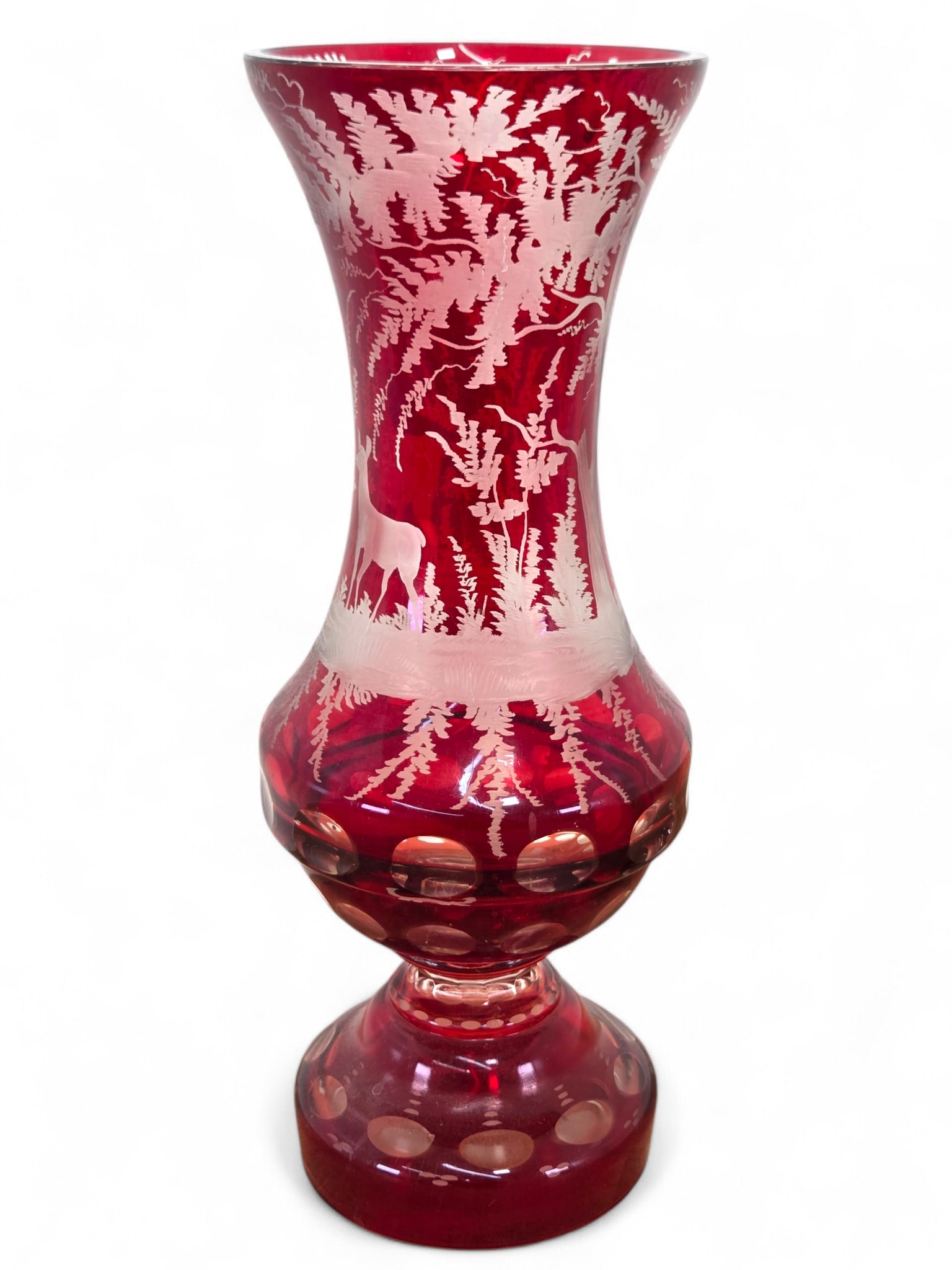 Bohemian Ruby Cut To Clear Glass Vase W/ Stag & Forest Decoration: Ruby cut clear crystal glass with a forest scene with trees and a stag and deer. Item appears to be unsigned. Wear consistent with age and use including surface wear and scratches. See photos for more