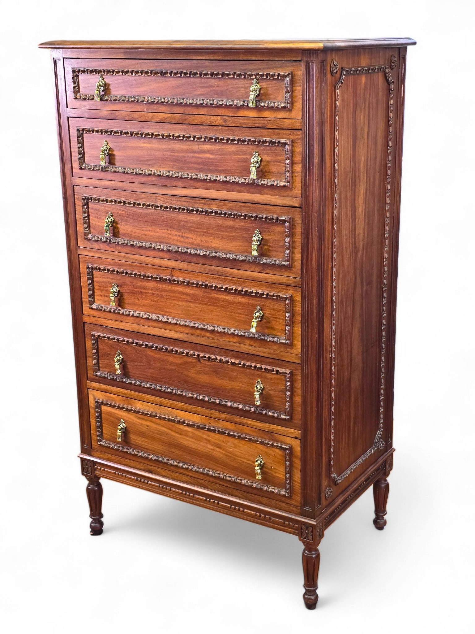 Antique Louis XVI Style Walnut Chest of Drawers / Dresser: The dresser is in good overall used antique condition, showing finish ware as expected with age and use. The piece is covered in applied wood carvings throughout, with decorative drawer pulls. Appeari