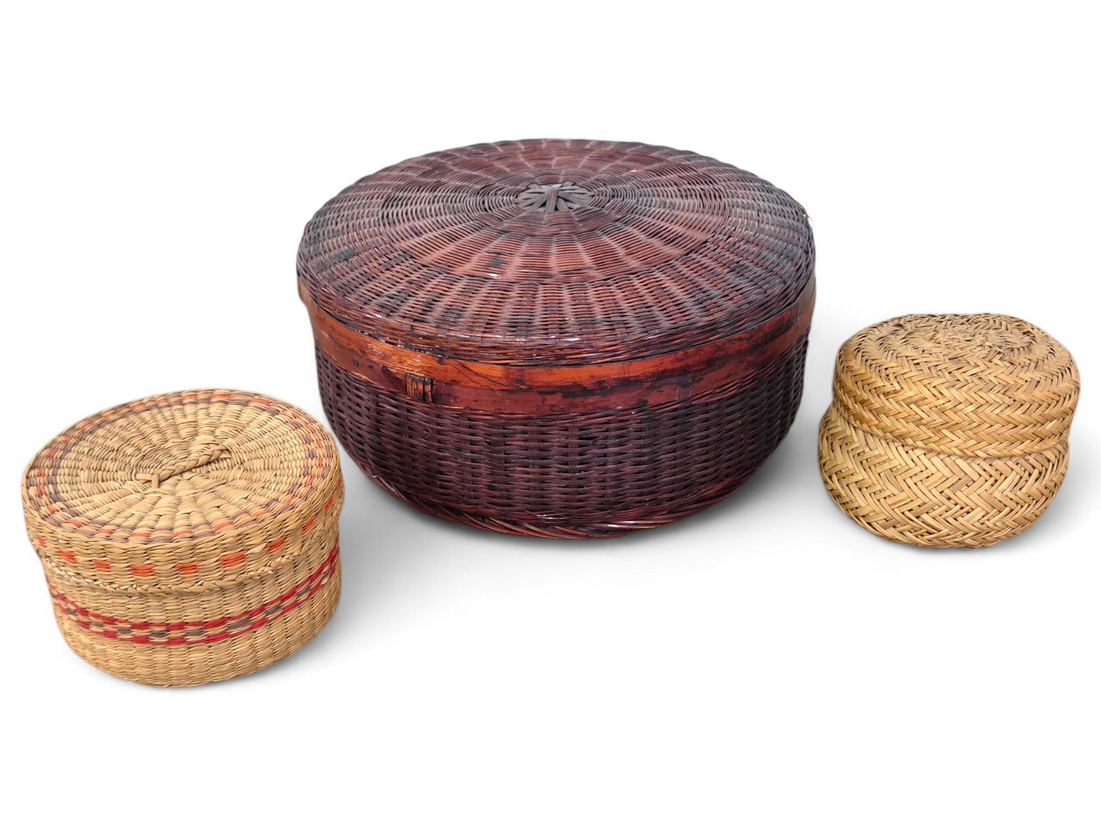 (3pc) Lidded Woven Sewing Baskets: Four circular lidded baskets, one with dyed colorful woven elements. Likely early 20th Century Native American. Wear consistent with age and use including some loose woven pieces and small breaks. See