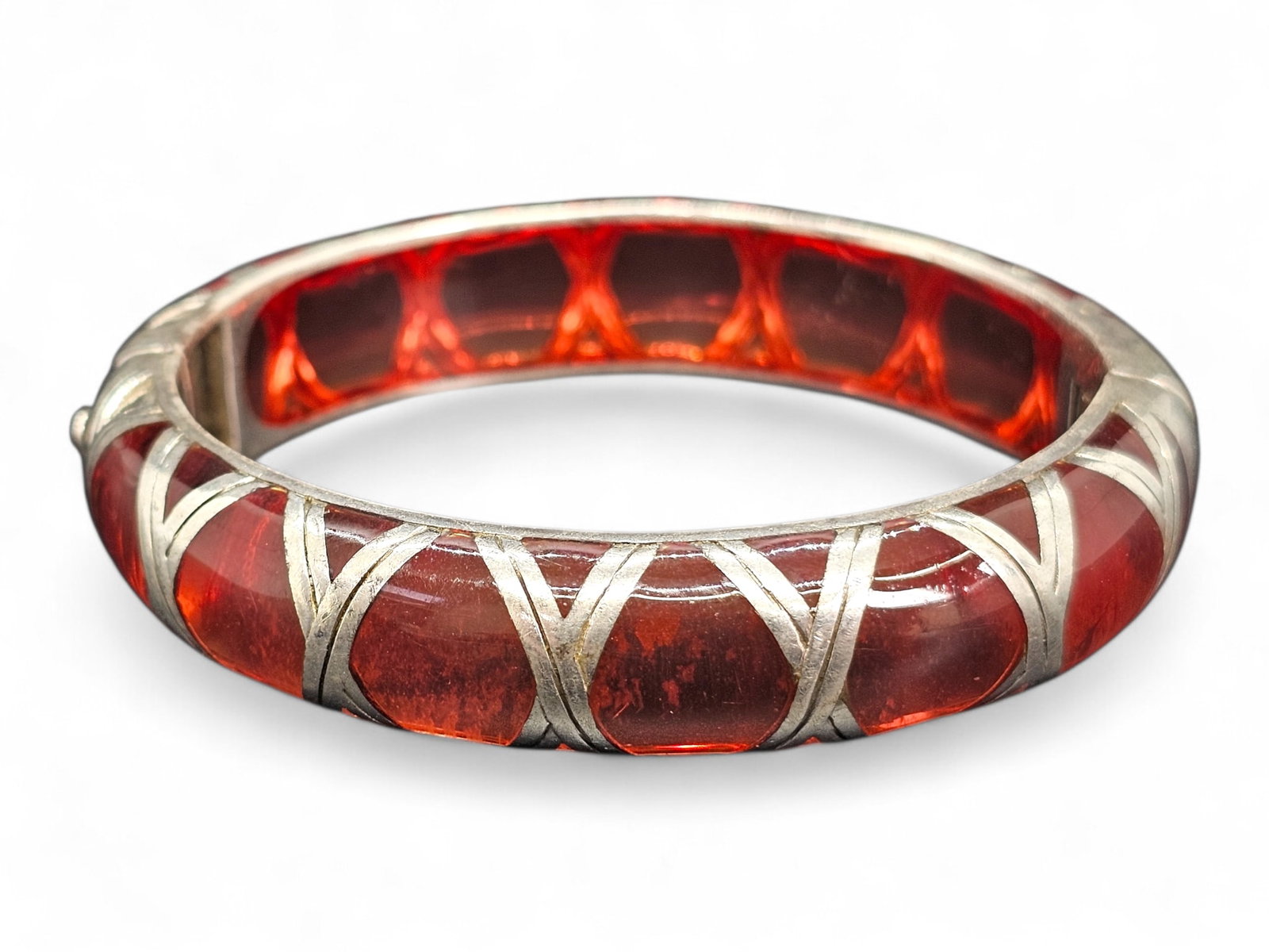 Angelique de Paris Red Resin with Sterling Silver Overlay Hinged Bangle Bracelet: Details: The bracelet features a deep red resin core with fine sterling silver overlay throughout. Material: Red Resin & Sterling SilverBrand/Designer: Angelique de Paris - Signed "