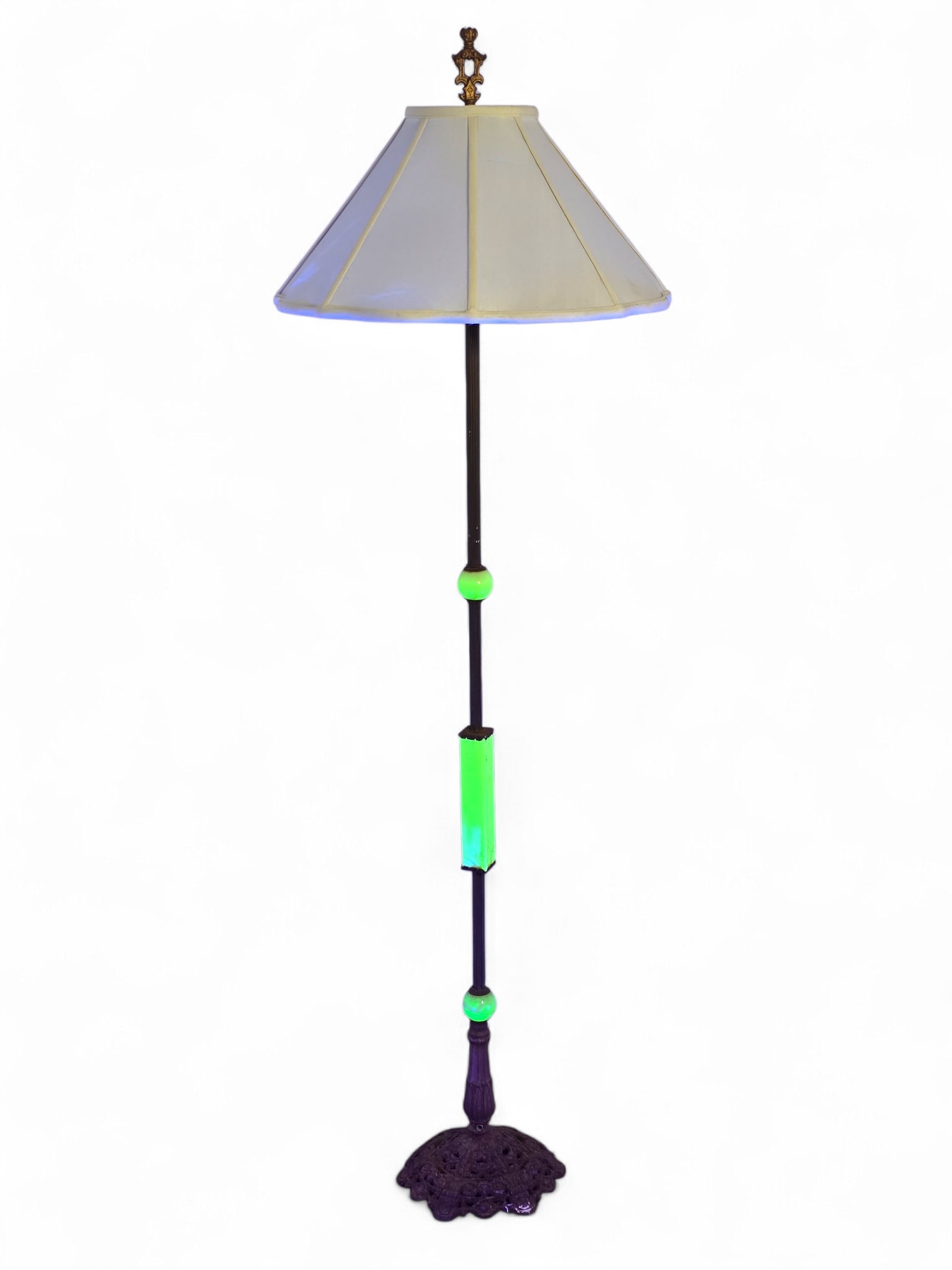 Antique Uranium Slag Glass Floor Lamp:  Antique floor lamp with cast metal base and uranium slag glass accents. The glass is UV-reactive and glows under a blacklight. Wear consistent with age and use including oxidation and some heav