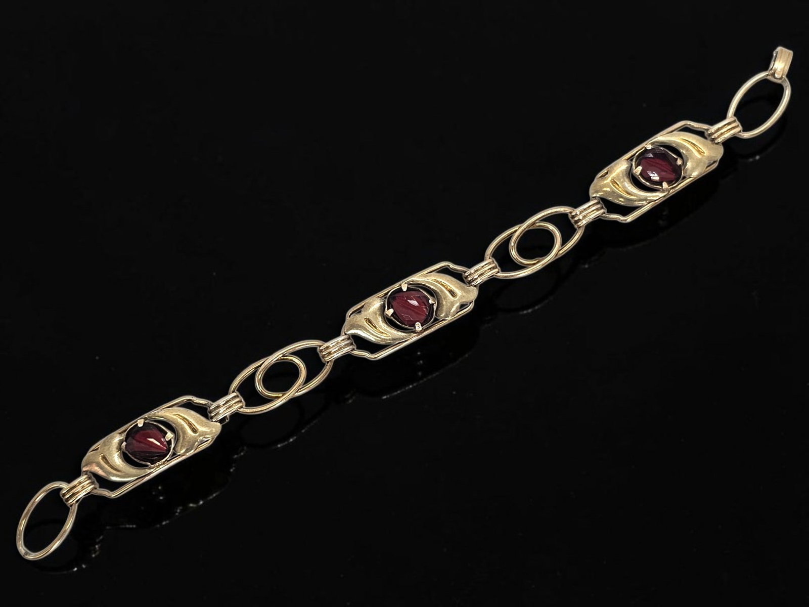 Providence Stock 12K GF Sterling Heart Bracelet: Details: Mid-century Retro Era link bracelet crafted by the Providence Stock Company. Features open-backed structural gold-over-silver panels housing vibrant, prong-set ruby red glass cabochons in a r