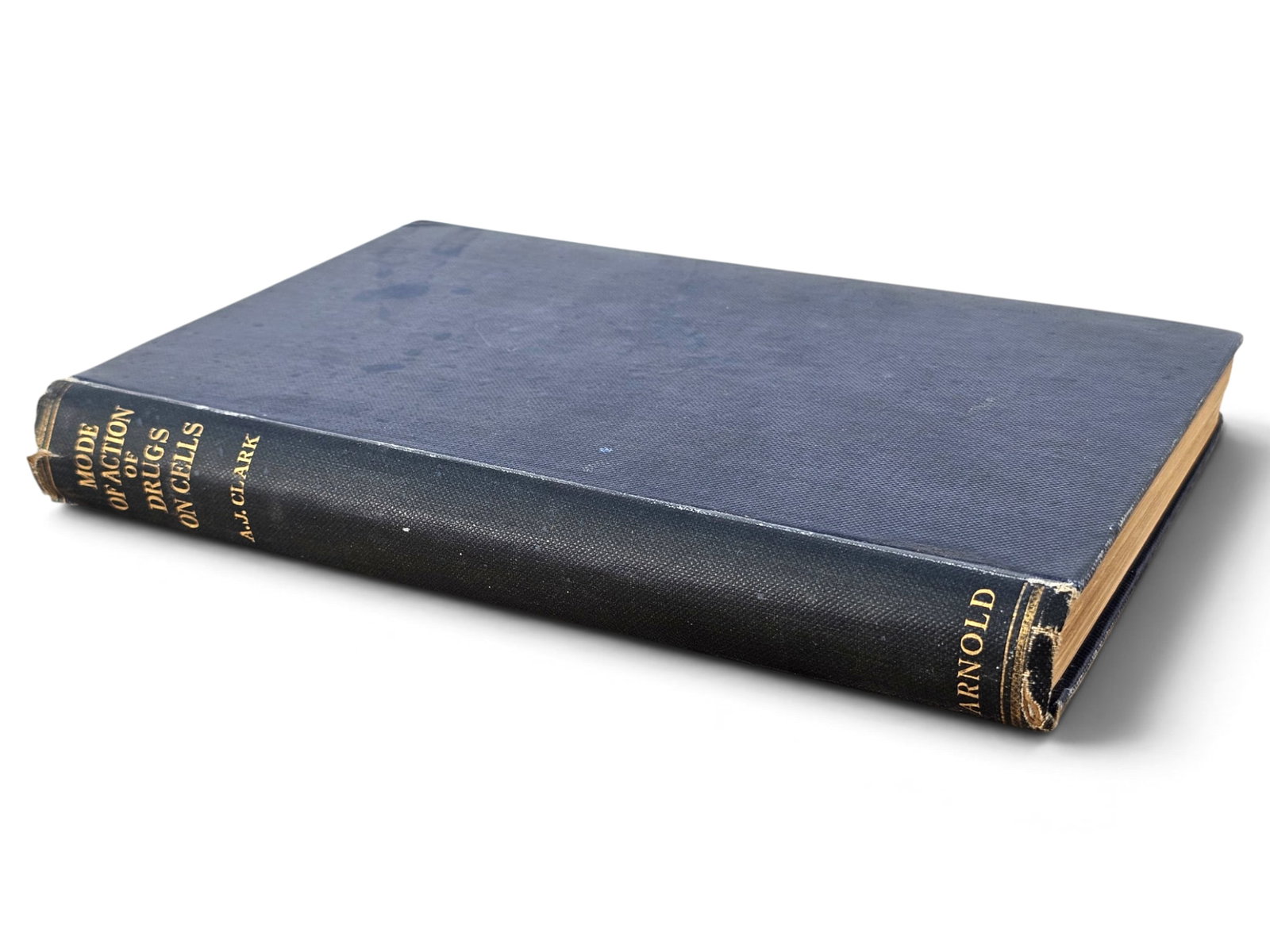 A.J. Clark "Mode of Action of Drugs on Cells" 1st: First edition hardcover of Alfred Joseph Clark's "The Mode of Action of Drugs on Cells." Published by Edward Arnold & Co., London, 1933. Bound in the original blue cloth with gilt lettering on the spi