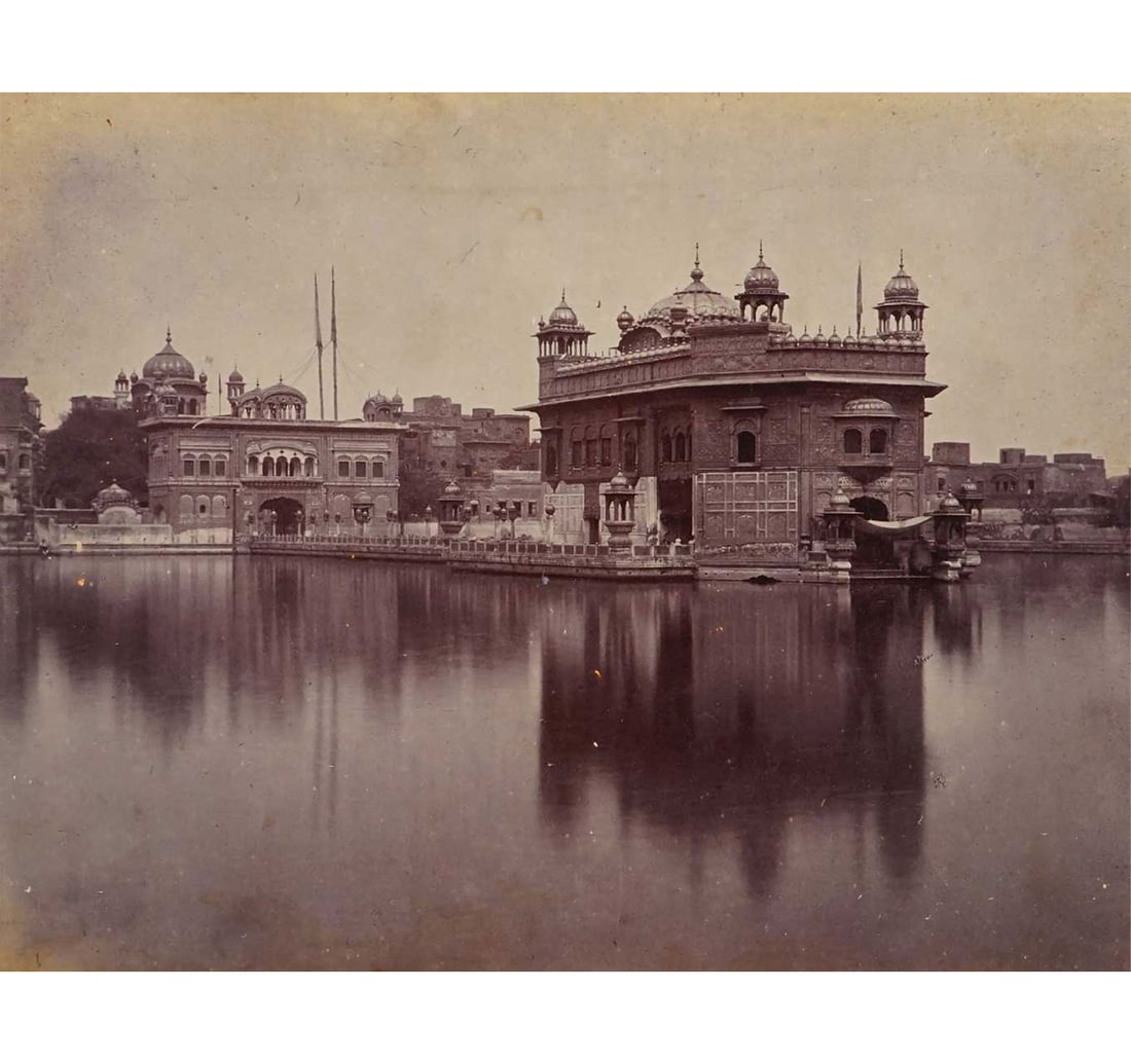 MONOCHROME PHOTOGRAPH: THE GOLDEN TEMPLE: Size: 20 x 25.3 cm (7.8 x 9.9 inches) Mount/Sheet Size: 28 x 33.8 cm (11 x 13.3 inches) The image captures a serene, mirror-like reflection of the main sanctum on the sacred Amrit Sarovar. In the