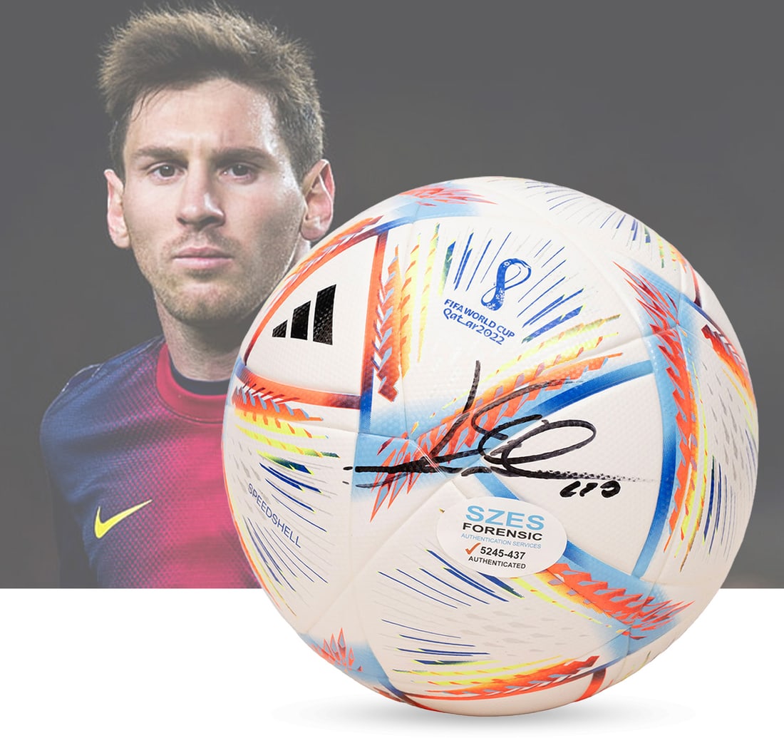 LIONEL MESSI'S AUTOGRAPHED AL RIHLA 2022 WORLD CUP OFFICIEAL FOOTBALL: Features a striking, bold black signed autograph of Lionel Messi, placed prominently on the ball's surface. The lot is accompanied by a forensic authentication seal and comprehensive certification