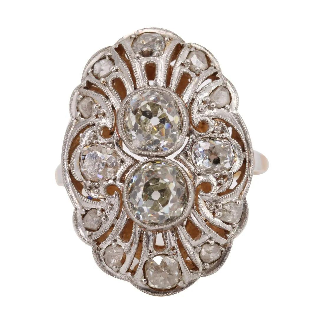Art Deco 18k gold Ring With Old mine Diamonds: Art Deco Ring crafted in 18k yellow Gold and Platinum on Top, set with Two Old European cut Diamonds weighing together Approx. 1.90 carats. L color, VS2 clarity. Along with Old mine and Single cut Dia