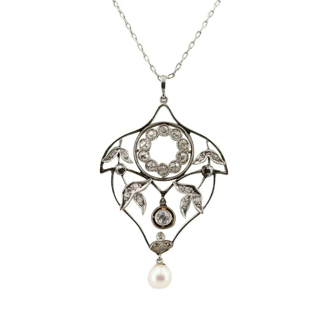 Diamonds, Pearl & Platinum Art Deco Pendant: Circa 1910/20s, Art Deco Pendant crafted in Platinum, set with a Round cream Pearl about 6 mm diameter. Accented with Old mine and rose cut Diamonds with a Total carat weight of Approx. 1.05 carats. M