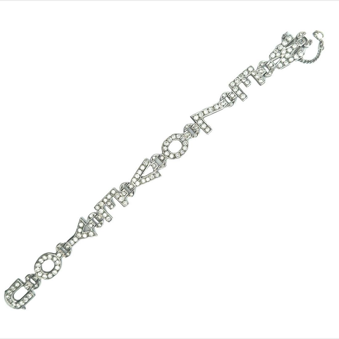 6.30 ctw in Diamonds Art Deco Platinum Bracelet: Circa 1920-40. Art deco Bracelet Featuring "WE LOVE YOU". Accented with Full cut Diamonds weighing together Approx. 6.30 Carats. G-H color, VS1 clarity. Measurements: 7.5 x 0.4 inches. Total weight: 1