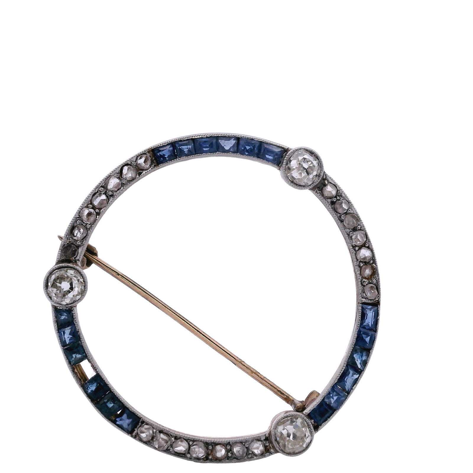 Art Deco 18k Gold and Platinum Diamonds and Sapphires Brooch: Art deco 18k yellow Gold and Platinum on top, featuring three Old mine Diamonds weighing Approx. 0.60 carats. Along with Rose cut Diamonds and natural blue Sapphires weighing Approx. 1.00 carats. Broo