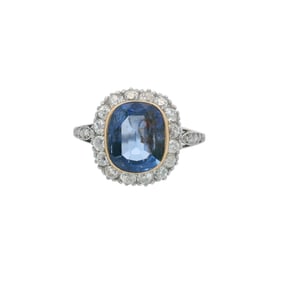 Antique Platinum Halo Ring with Sapphire and Diamonds
