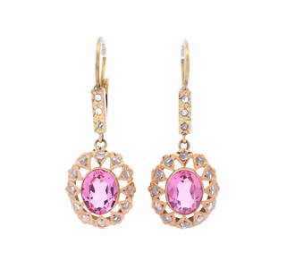 18kt yellow Gold Earrings with Pink Tourmaline and Diamonds: Pair of 18kt yellow Gold Rosetta Drop Earrings set with two oval shaped Pink Tourmalines weighing together Approx. 3.50 carats. Accented with Rose cut Diamonds. Measurements: 1.40 x 0.55 inches. Total