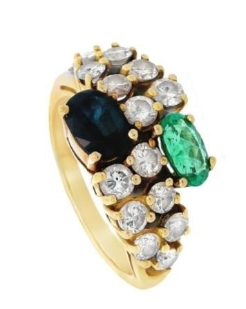 Vintage 18kt Gold Ring with Diamonds, Emerald and Sapphire: This stunning 1970-80s vintage ring in size 8 (resizable) weighs 7.0 grams and is masterfully crafted in luxurious 18k yellow gold with a width of 0.44 inches. Features a captivating oval-cut sapphire
