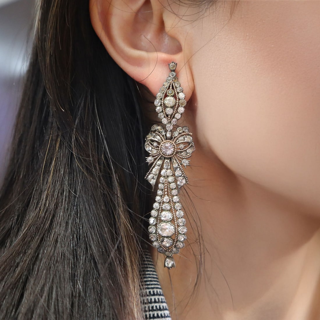 1780s Portuguese Antique Black Dot Paste and Silver Earrings: Fantastic 18th century black dot paste drop Earrings set in silver with a bow motif. These elegant Earrings are rare and desirable, wonderful to wear for evenings on the town. The Earrings measure 3 1
