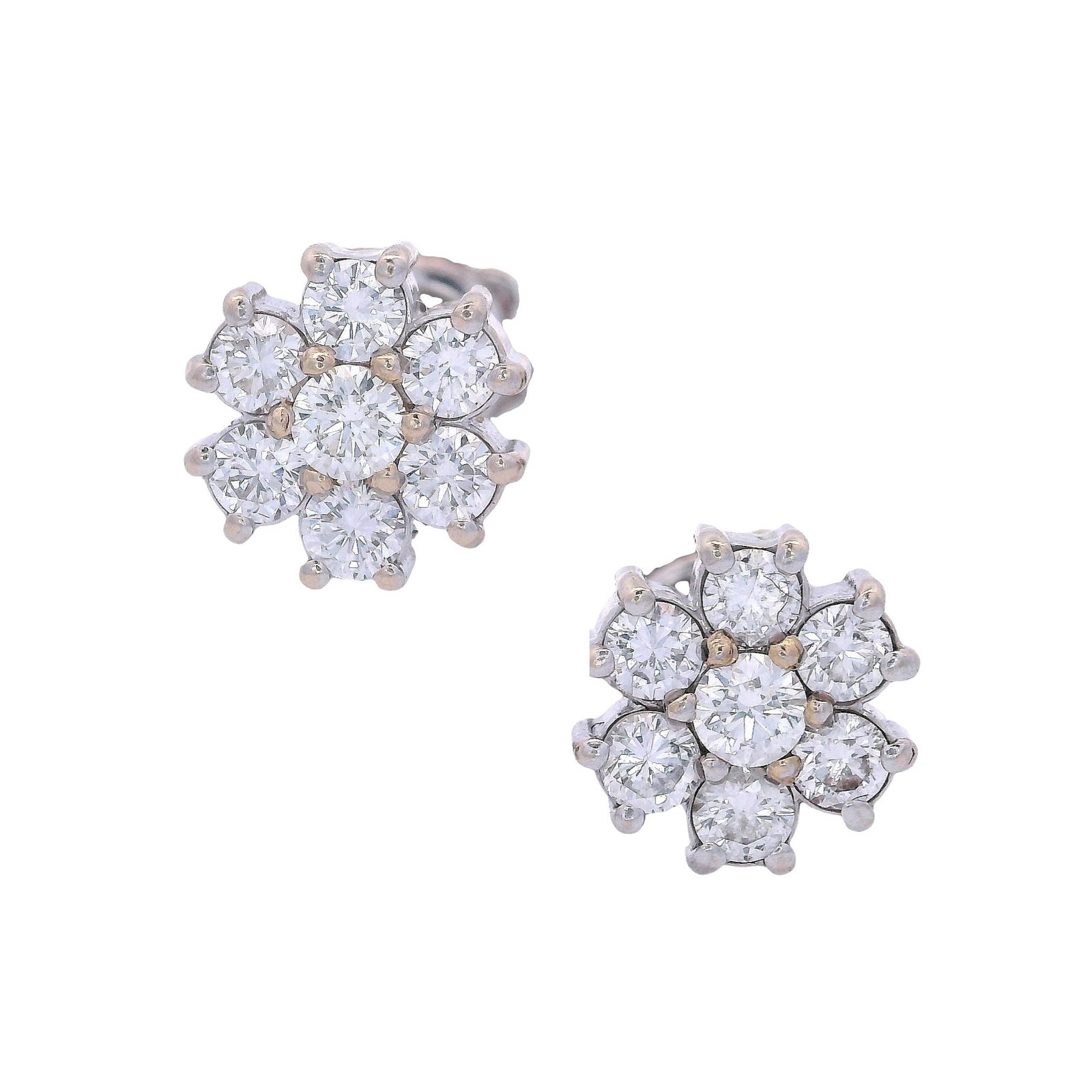 18kt white Gold Studs Earrings with 0.82 Cts in Diamonds: Pair of Studs Earrings crafted from 18kt white Gold, accented with 14 Round cut Diamonds weighing togehter Approx. 0.82 carats. H-I color, VS2 clarity. Diameter: 0.32 inches (8.33 mm). Total weight: 2