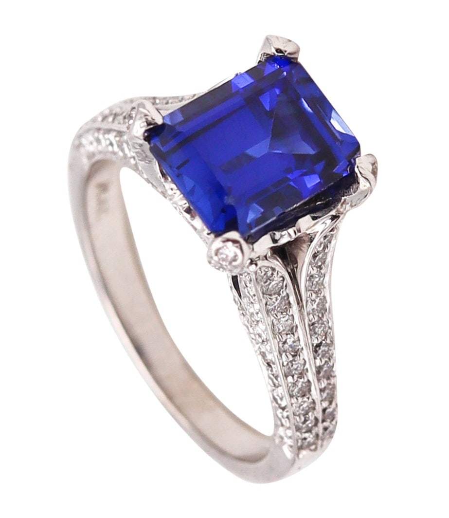 Charles Krypell Modern Ring In Platinum With 4.91 Ctw In Diamonds And Tanzanite: Beautiful contemporary ring by Charles Krypell, crafted in solid .950 platinum with high polish and classical patterns. Features a four-prong set rectangular step cut AAA purplish blue tanzanite (9 x
