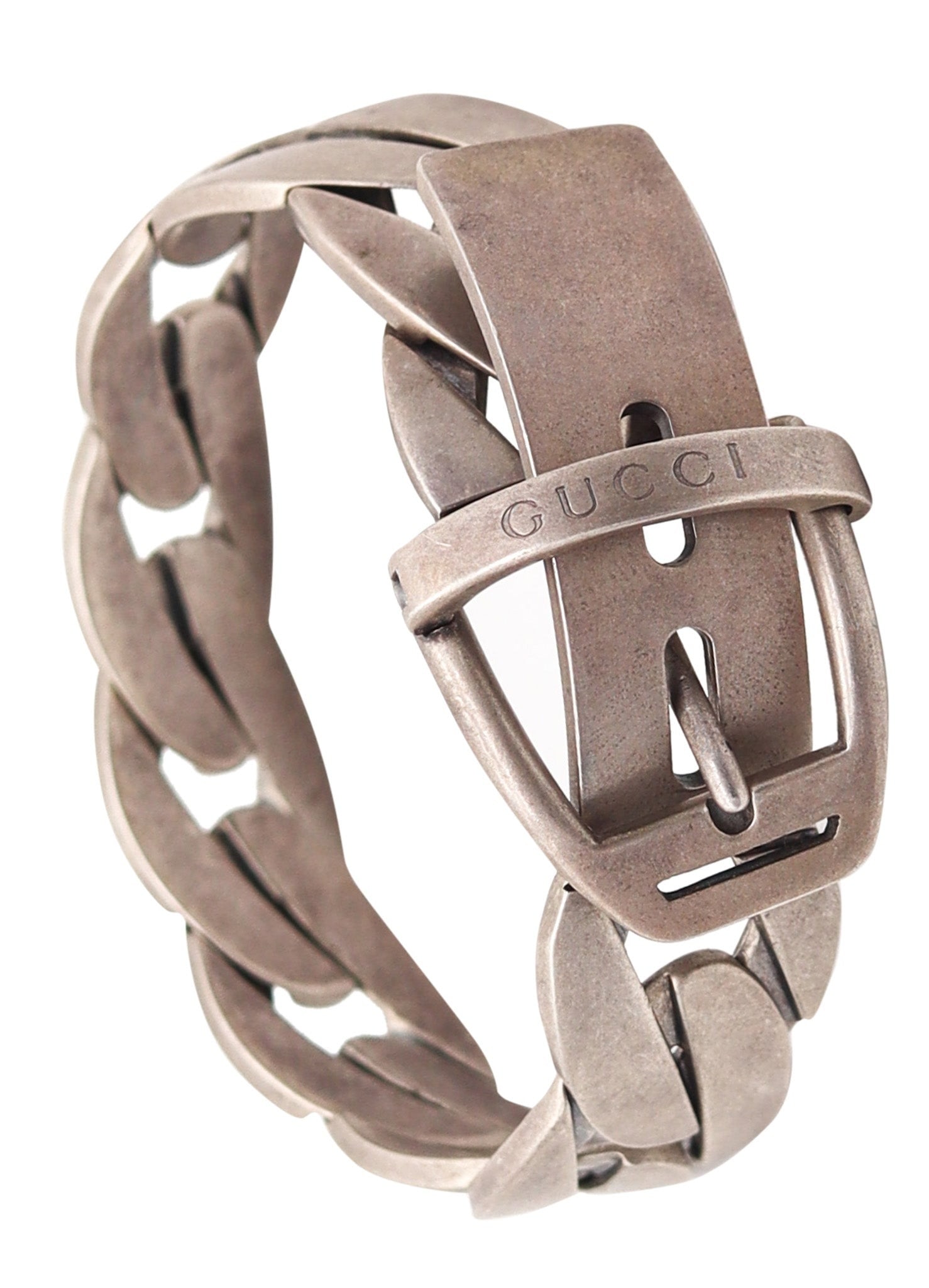 GUCCI 1990 Firenze Modernist Chained Buckle Bracelet In Brushed .925 Sterling Silver: Iconic vintage buckle bracelet by Gucci, Florence, 1990, crafted in solid .925 sterling silver with brushed finish. Features a flexible buckle closure system and a modernist design. Measures 30 mm wid