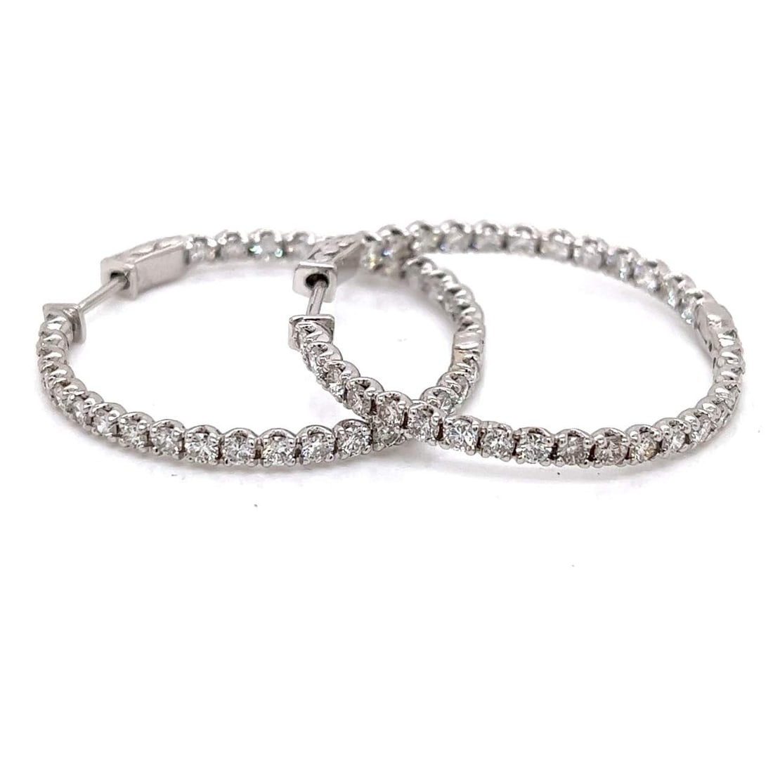14K White Gold 5.44 Ct. Diamond Hoop Earrings: 14K white gold diamond hoop earrings set with 62 diamonds totaling 5.44 carats (F–H color, VS1–SI1 clarity), delivering bold, continuous sparkle in a classic 1.5-inch silhouette. Total weight 9.2