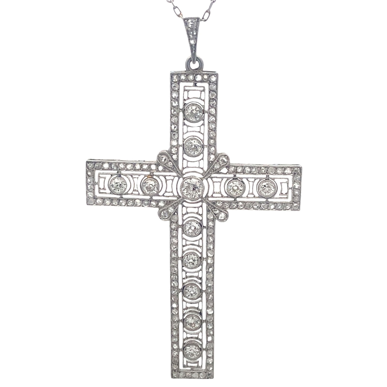 Art Deco Platinum Filigree Cross Pendant Necklace with 1.80 Cts in Diamonds: Spectacular Art Deco Cross Pendant and Diamond by the Yard Chain crafted both from Platinum. Cross is composed by 12 Old mine Diamonds & Embellished with rose cut Diamonds weighing together Approx. 1.
