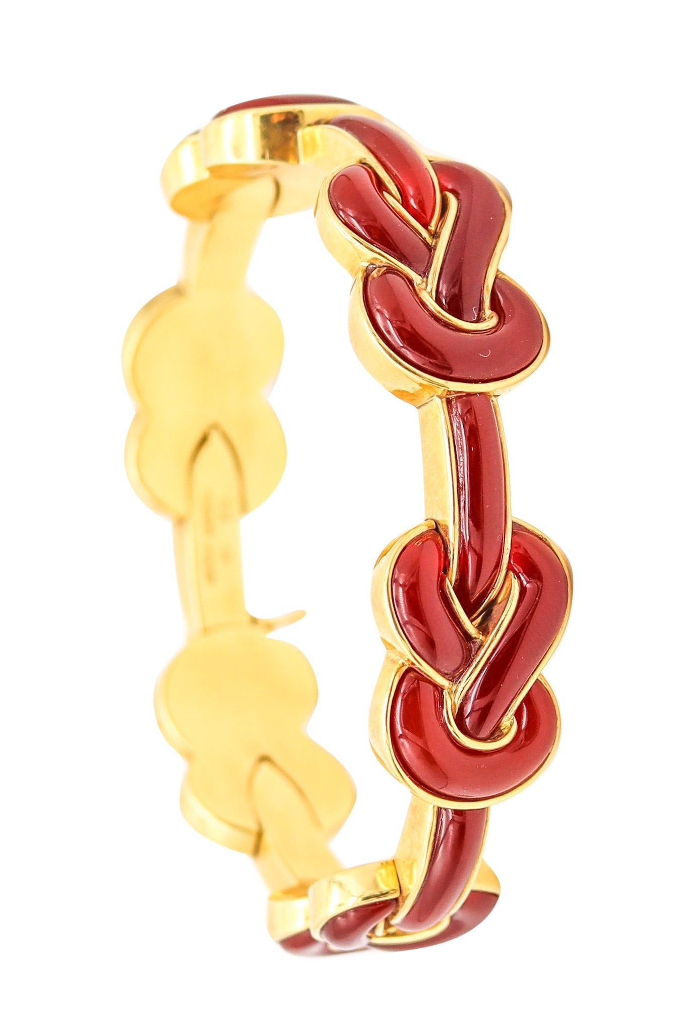 ANGELA CUMMINGS Vintage Knots Bracelet in 18Kt Yellow Gold With Red Carnelian: A gorgeous Angela Cummings bracelet created in New York City (circa 1980s), designed as a series of sculptural links in the form of Hercules knots—often called “pretzels”—for a bold, iconi