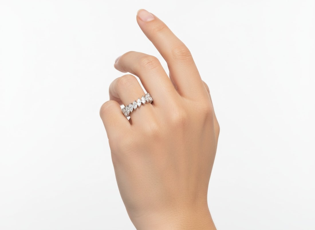 Platinum 3.55 Ct. Diamond Eternity Band: Platinum eternity band set with 21 marquise diamonds totaling approximately 3.55 carats in F-I color, VS1-SI1 clarity. Weighing 5.2 grams and sized at 7, this elegant ring delivers continuous, elongat