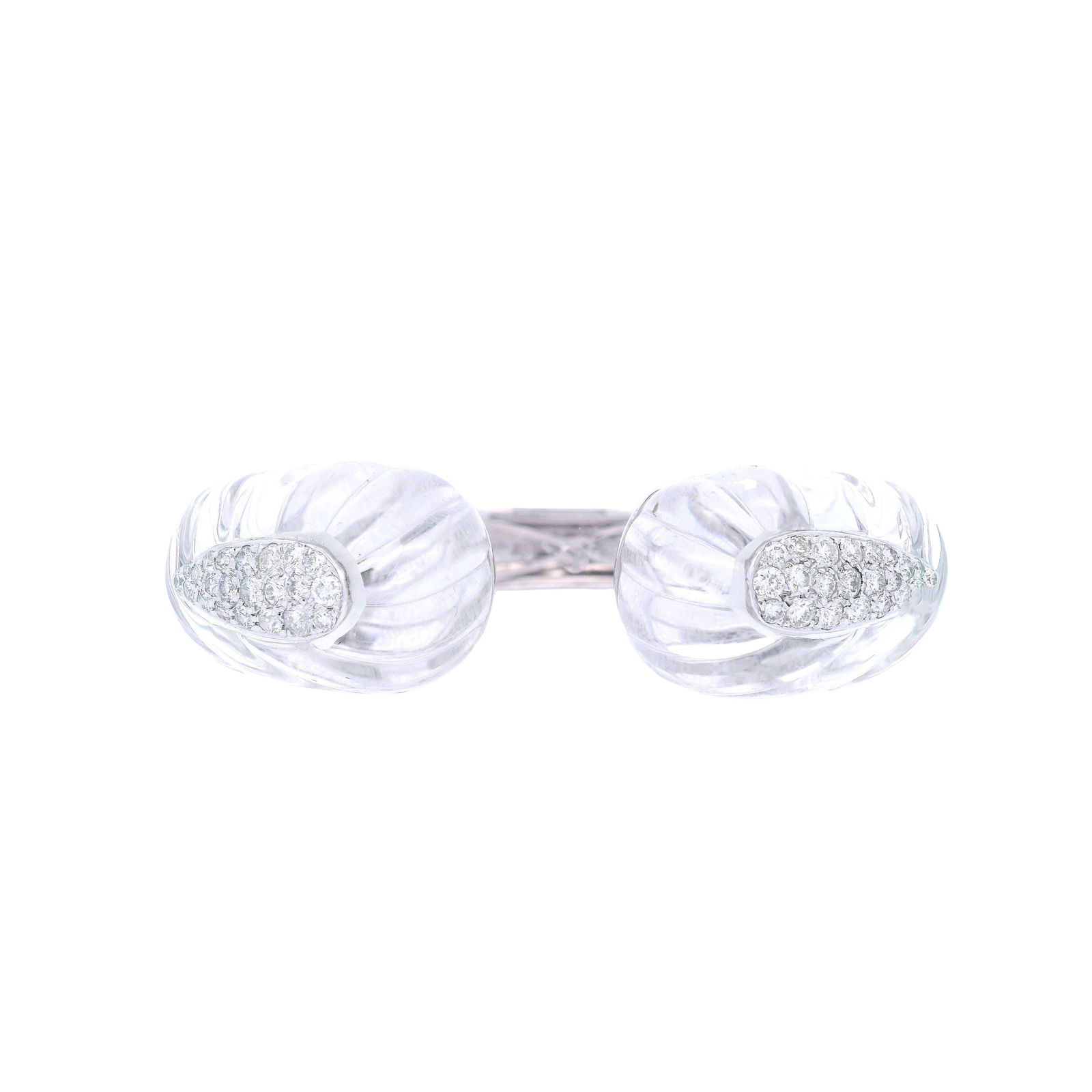 Mid-Century 18kt white Gold Cuff Bracelet with Rock Crystal & Diamonds: Mid-century cuff bracelet crafted in 18kt white gold, featuring two sculptural pieces of high-polished carved rock crystal and a pavé of forty-four round brilliant-cut diamonds totaling approximately
