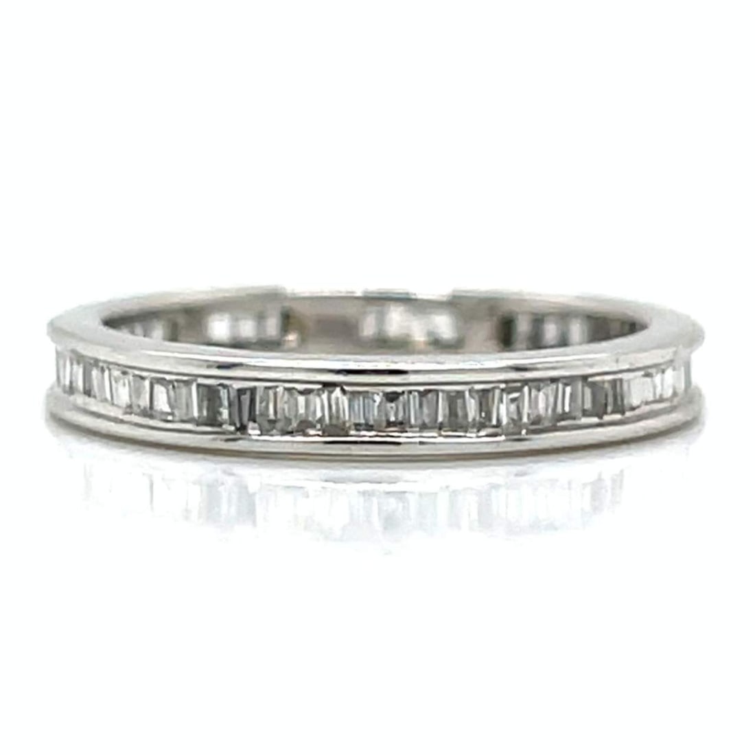 18K White Gold 1.00 Ct. Diamond Eternity Band: 18K white gold eternity band set with approximately 1.00 carat of G-H color diamonds in SI1-I1 clarity. Weighing 2.0 grams and sized at 5, this sleek ring offers continuous sparkle in a clean, easy-to