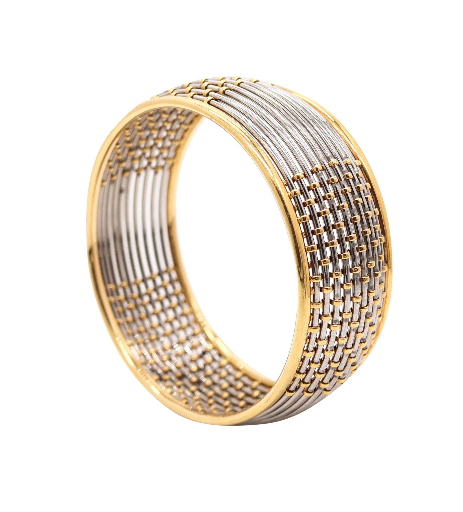 CARTIER 1970 Geometric Bangle Bracelet In 18Kt Yellow Gold And Steel: A very rare Cartier modernist bangle bracelet from Paris (circa 1970), masterfully executed with bold geometric rhythm in solid 18k yellow gold accented by ten slender steel wires. Finished in a high